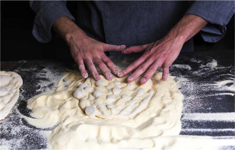 Hands on pizza dough
